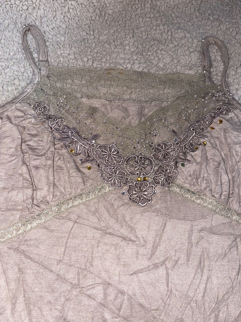 Beaded Lace Trim Camisole Top (Category: Sleeveless) located in Manila. Submitted by fastforest_65f95b (Listing ID 1463567260, Image 1). Description: - Cute camisole top - Intricate beaded lace detailing on neckline - Adjustable straps for a perfect fit - Light, neutral color with a slight sheen - Versatile: great for layering or wearing on its own.