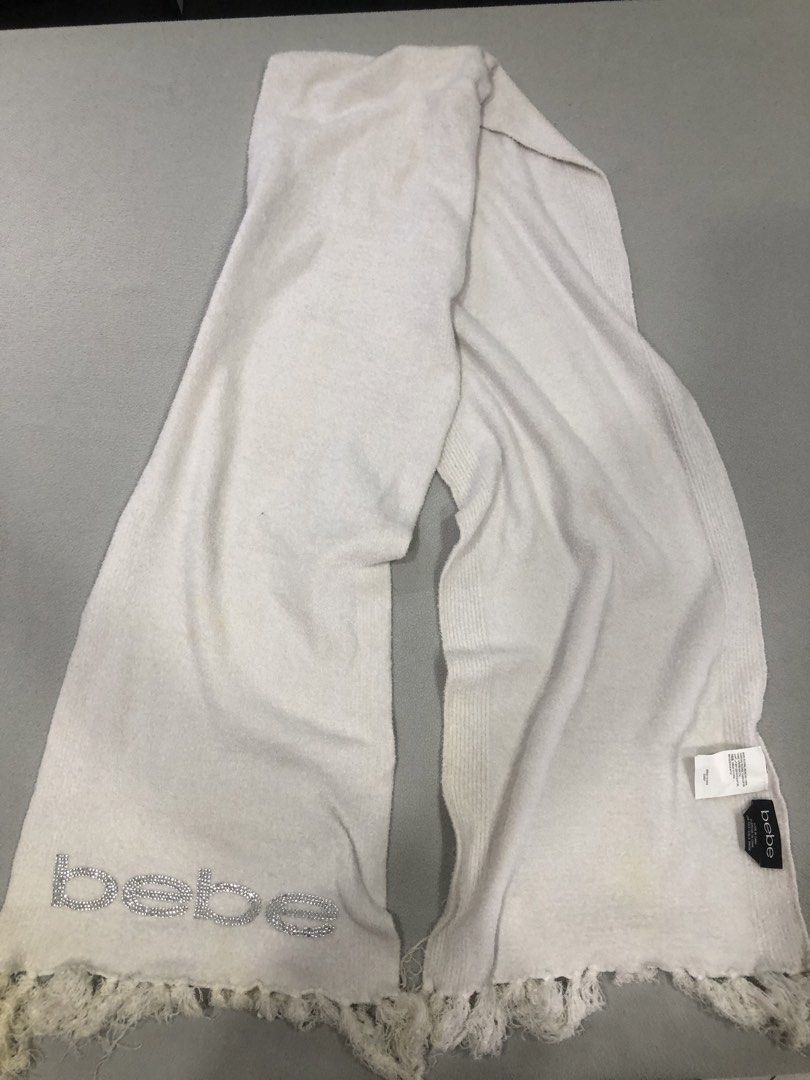 Bebe Scarf with Rhinestone Logo (Category: Scarves) located in Manila. Submitted by janmichael26601 (Listing ID 1463583534, Image 1). Description: - White/cream colored scarf from Bebe - Features the Bebe logo in rhinestones on one end - Fringed edges - Made in China - One size fits all - Perfect accessory to add sparkle to any outfit -issue: need wash.