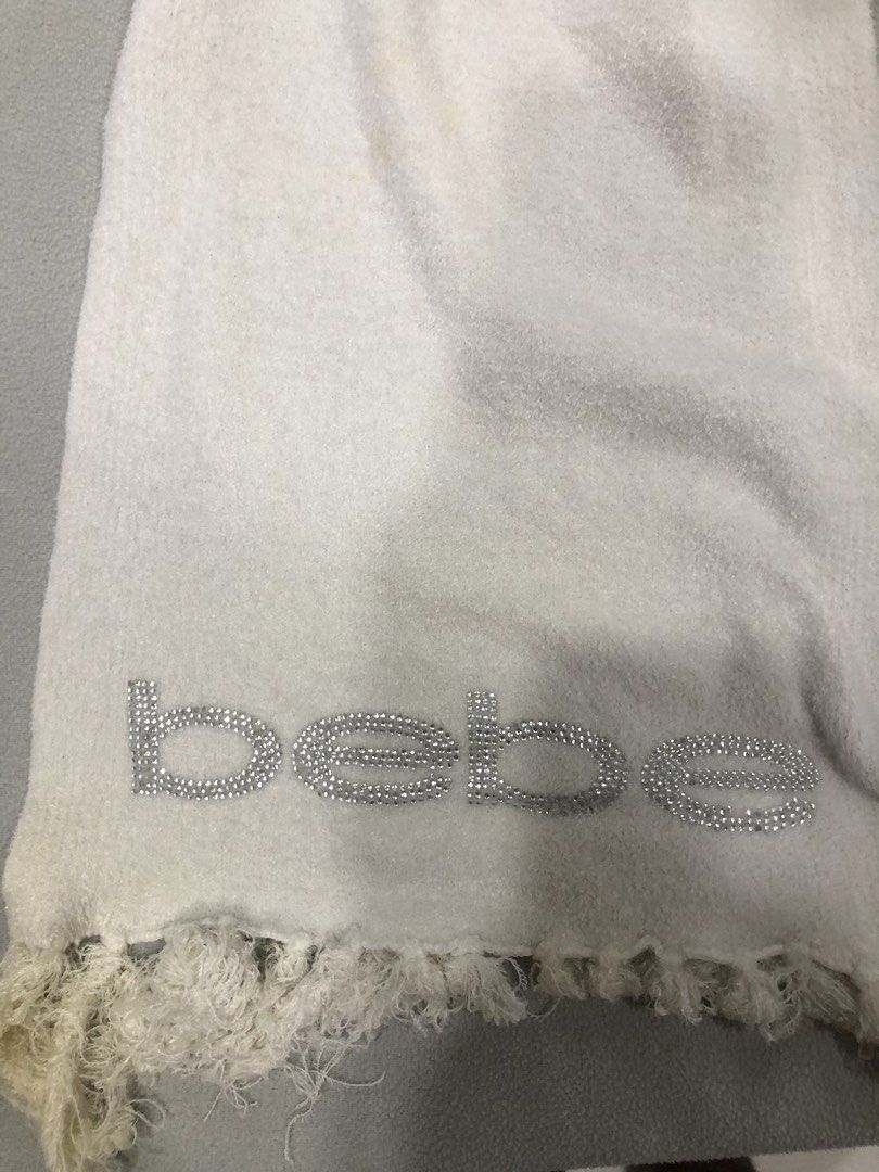 Bebe Scarf with Rhinestone Logo (Category: Scarves) located in Manila. Submitted by janmichael26601 (Listing ID 1463583534, Image 3). Description: - White/cream colored scarf from Bebe - Features the Bebe logo in rhinestones on one end - Fringed edges - Made in China - One size fits all - Perfect accessory to add sparkle to any outfit -issue: need wash.