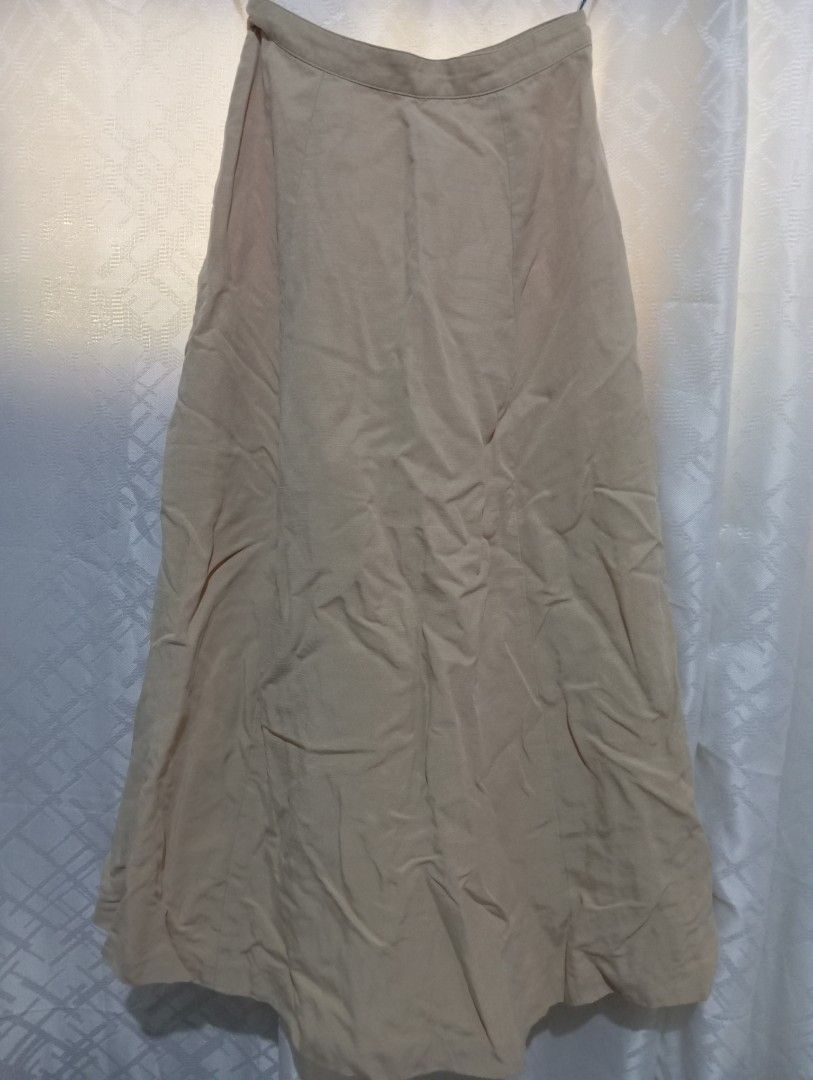 Beige A-line Midi Skirt (Category: Skirts) located in Dasmarinas. Submitted by kei05 (Listing ID 1463566976, Image 1). Description: - Simple beige midi skirt - Flattering A-line cut - Comfortable fabric - Ideal for casual or dressed-up occasions - Easy to pair with various tops - Features a visible waistband - Straight hemline Waistline 24 inches Length 33 inches.