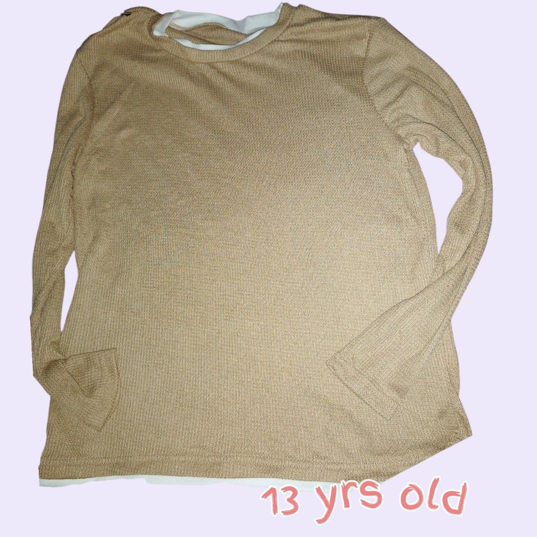 Beige Textured Long Sleeve Top with White Undershirt (Category: Babies & Kids Fashion) located in Manila. Submitted by crustynico23 (Listing ID 1463614653, Image 1). Description: - Beige textured long sleeve top - Includes a white undershirt layer - Features a subtle waffle knit pattern - Ideal for layering or wearing on its own - Suitable for a 13-year-old.