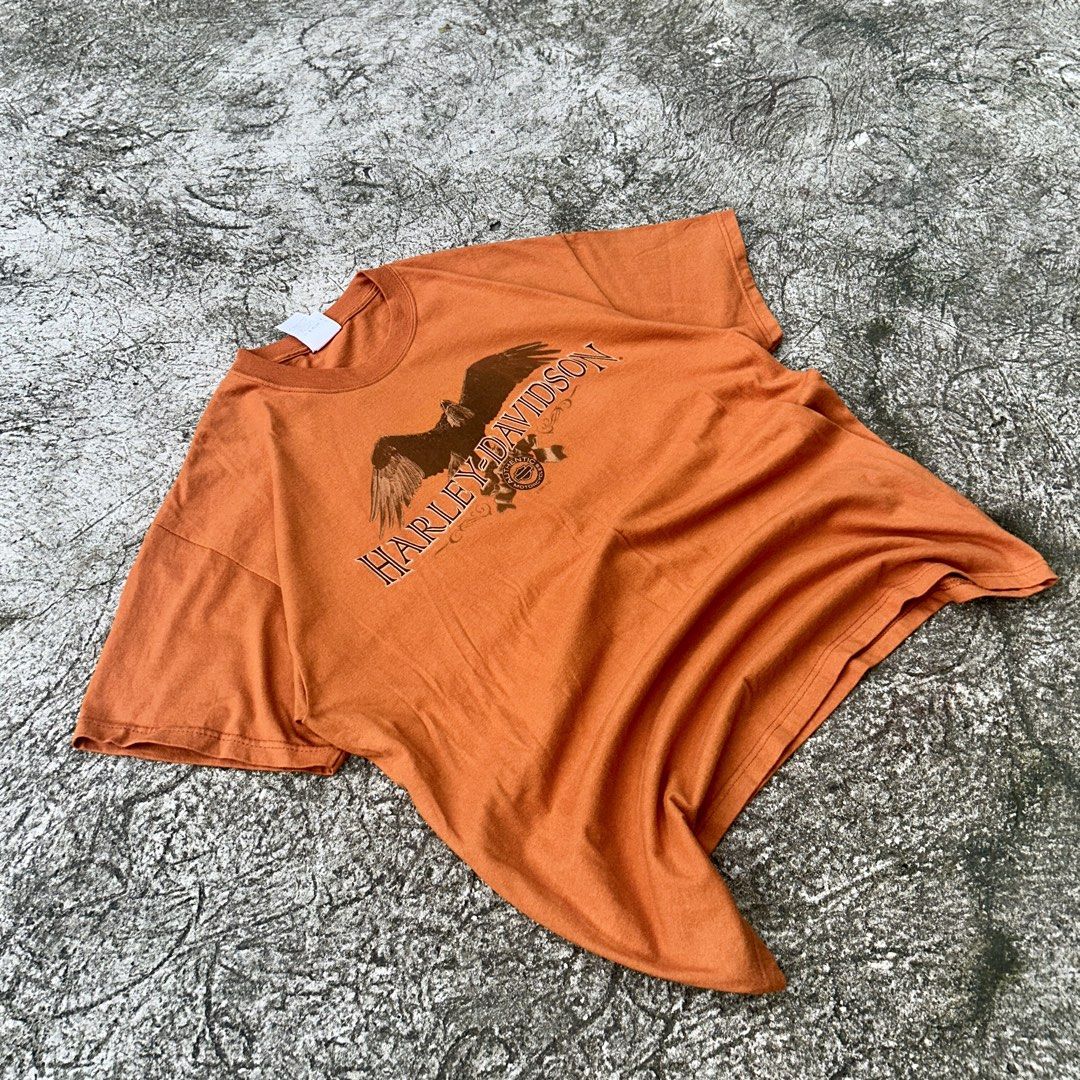 Screamin’ Eagle 🦅 | Vintage Harley Davidson (Category: Tshirts & Polo Shirts ) located in Manila. Submitted by thelocalrackph (Listing ID 1462765110, Image 1). Description: 2007 Harley-Davidson “Appalachian” Screamin’ Eagle Graphic Tee - Era / Copyright: Official ©2007 H-D Licensed Piece - Size: XL (Wide, relaxed drop-shoulder cut) - Colorway: Faded Rust / Safety Orange Details: - Front: Soaring bald eagle centerpiece framed by outlined serif le