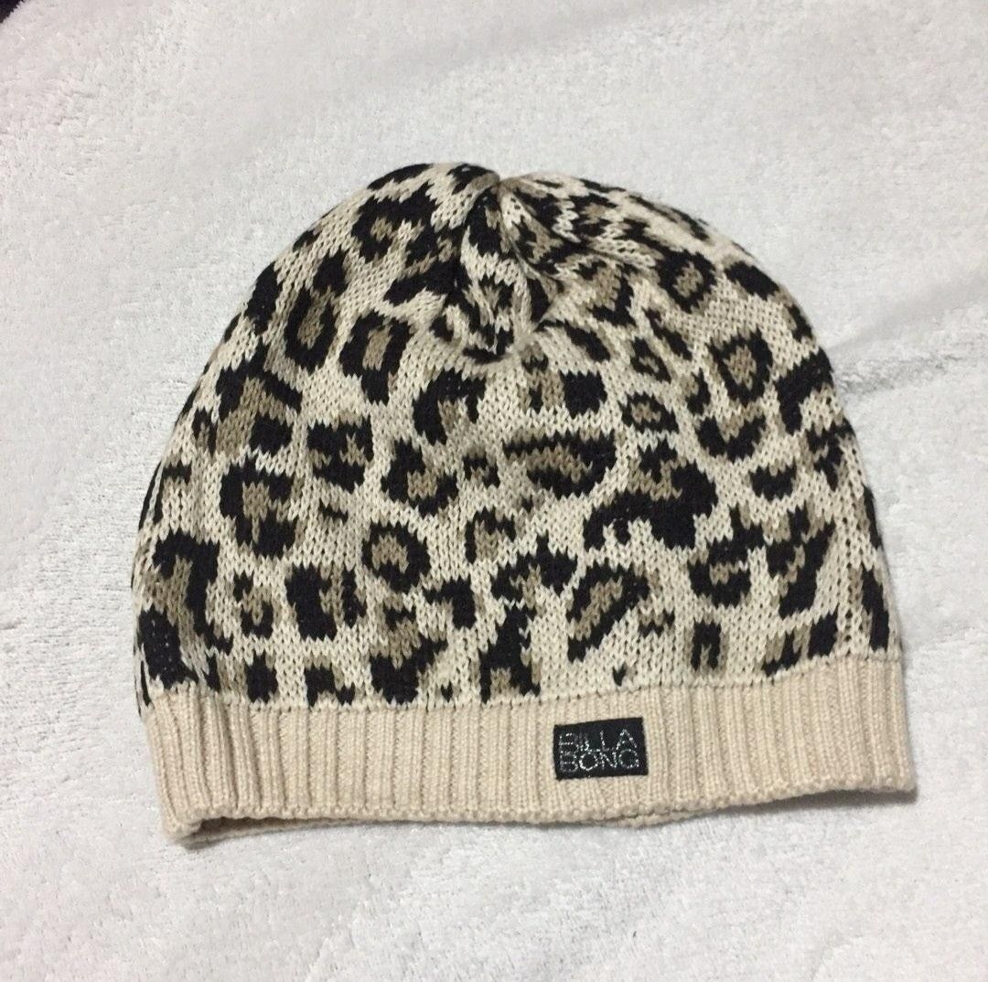 Billabong Leopard Print Knit Beanie (Category: Hats & Beanies) located in San Juan City. Submitted by marie_d_r (Listing ID 1463736023, Image 1). Description: - Brand: Billabong - Design: Cool leopard print - Colors: Cream, black, and tan - Features: Ribbed brim for a snug fit - Style: Perfect for keeping warm and adding a stylish touch to casual outfits.