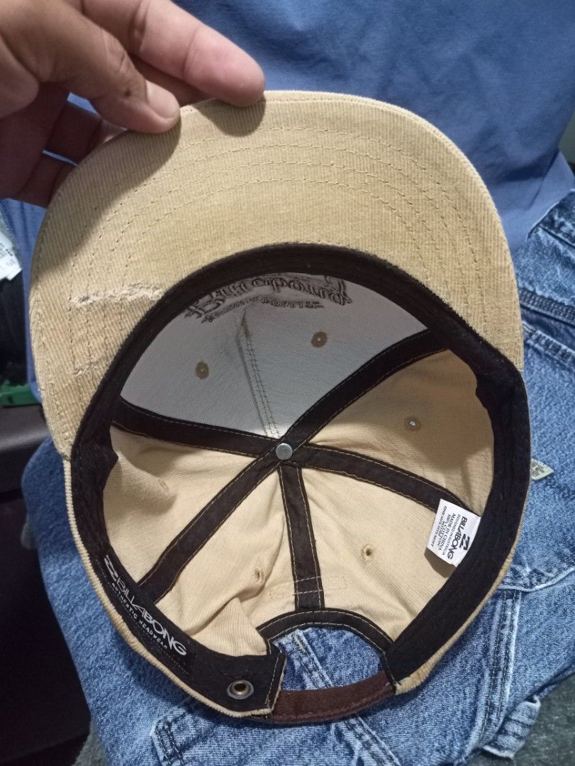 Billabong "Premium Quality" Snapback Cap (Category: Caps & Hats) located in Manila. Submitted by thecomftrift.co (Listing ID 1463718304, Image 3). Description: - Tan corduroy Billabong snapback cap - Features 'Premium Quality' and 'Billabong Est. 1973' embroidery on the front - 'Billabong Authentic Headwear' on the inside band - Adjustable strap at the back for a custom fit - Ideal for everyday casual wear.