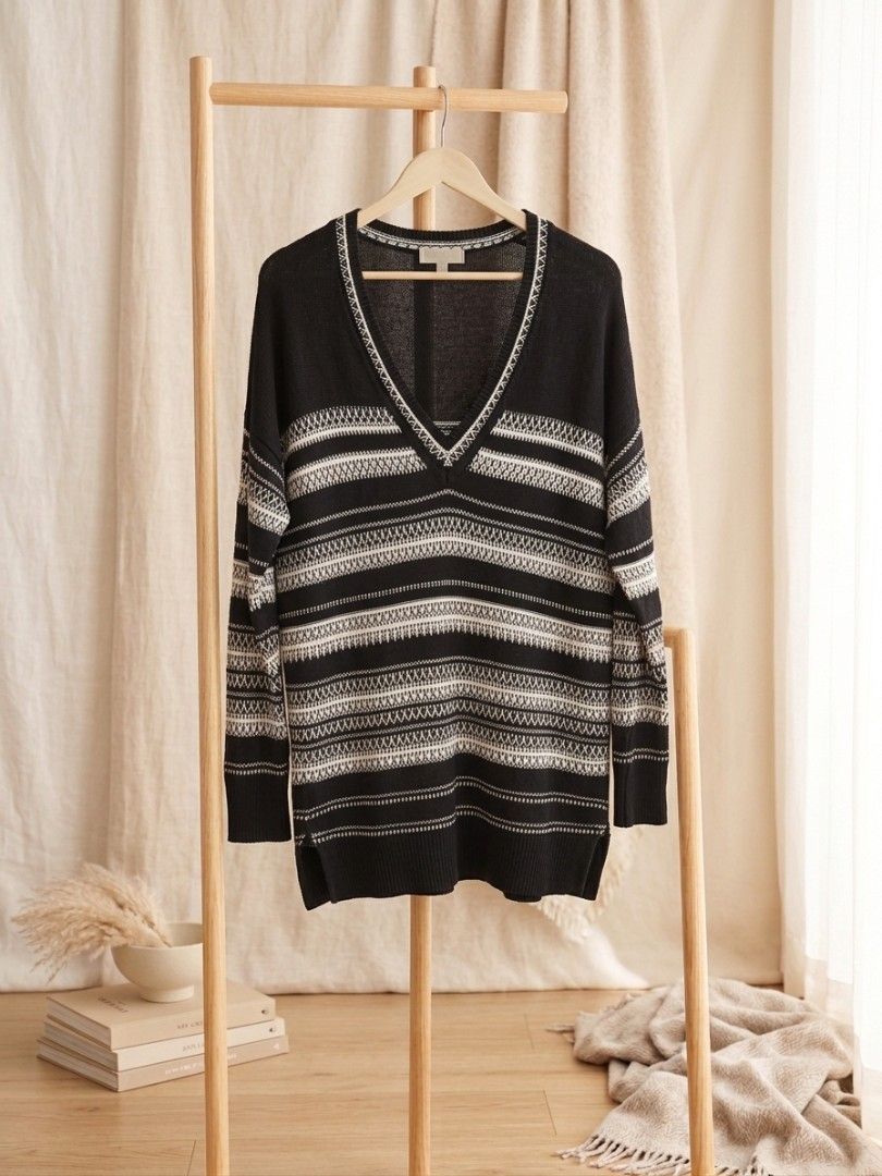 Black & White Striped V-Neck Sweater (oversized) (Category: Coats, Jackets and Outerwear) located in Quezon City. Submitted by yusett (Listing ID 1463647919, Image 1). Description: - Cozy black sweater - White and grey striped pattern - V-neck design - Versatile for layering or wearing on its own - Ideal for cooler weather - Comfortable and stylish - Great for casual outings or lounging at home.