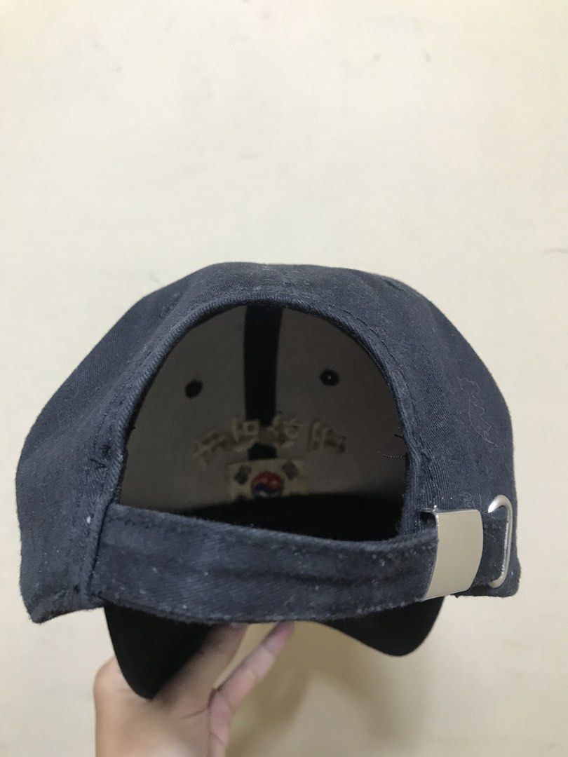 Black Baseball Cap with South Korea Flag and Text (Category: Caps & Hats) located in Baguio. Submitted by kurtshelby (Listing ID 1463611855, Image 3). Description: - Classic black baseball cap - Features embroidered Korean text '대한민국' (Daehan Minguk) and South Korean flag on the front - Adjustable strap with a metal buckle for a secure fit - 'BLUE' label inside, indicating one size fits most - Ideal for expressing national pride or as a stylish e