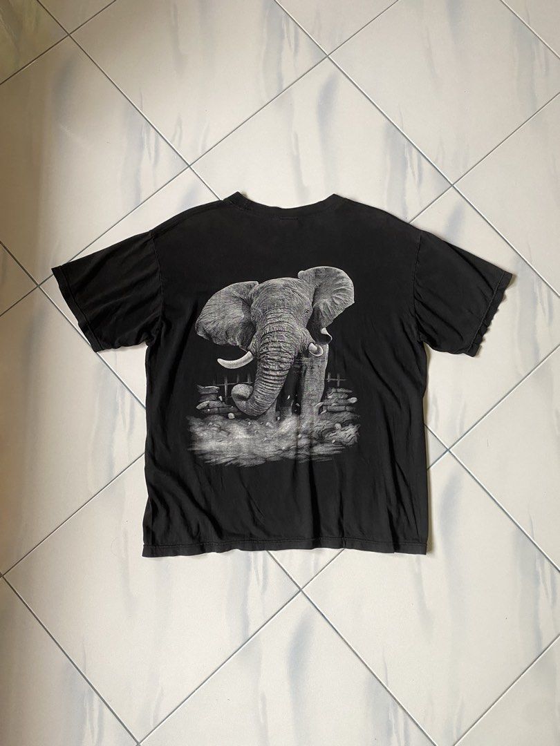 Black Elephant Graphic T-Shirt (Category: Shirts) located in Borongan. Submitted by cybutdiff (Listing ID 1463585532, Image 3). Description: - Cool black t-shirt - Detailed elephant graphic on front and back - Short sleeves - Crew neck - Vintage-inspired look - Great for casual wear - Unique design.