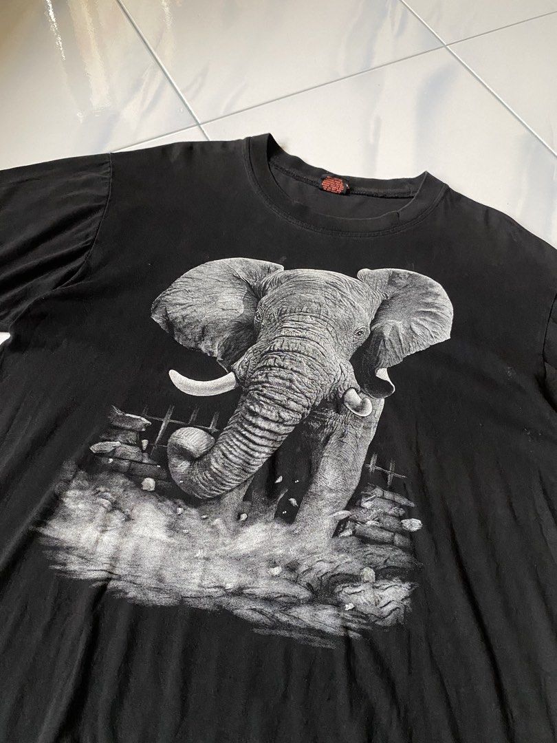 Black Elephant Graphic T-Shirt (Category: Shirts) located in Borongan. Submitted by cybutdiff (Listing ID 1463585532, Image 2). Description: - Cool black t-shirt - Detailed elephant graphic on front and back - Short sleeves - Crew neck - Vintage-inspired look - Great for casual wear - Unique design.