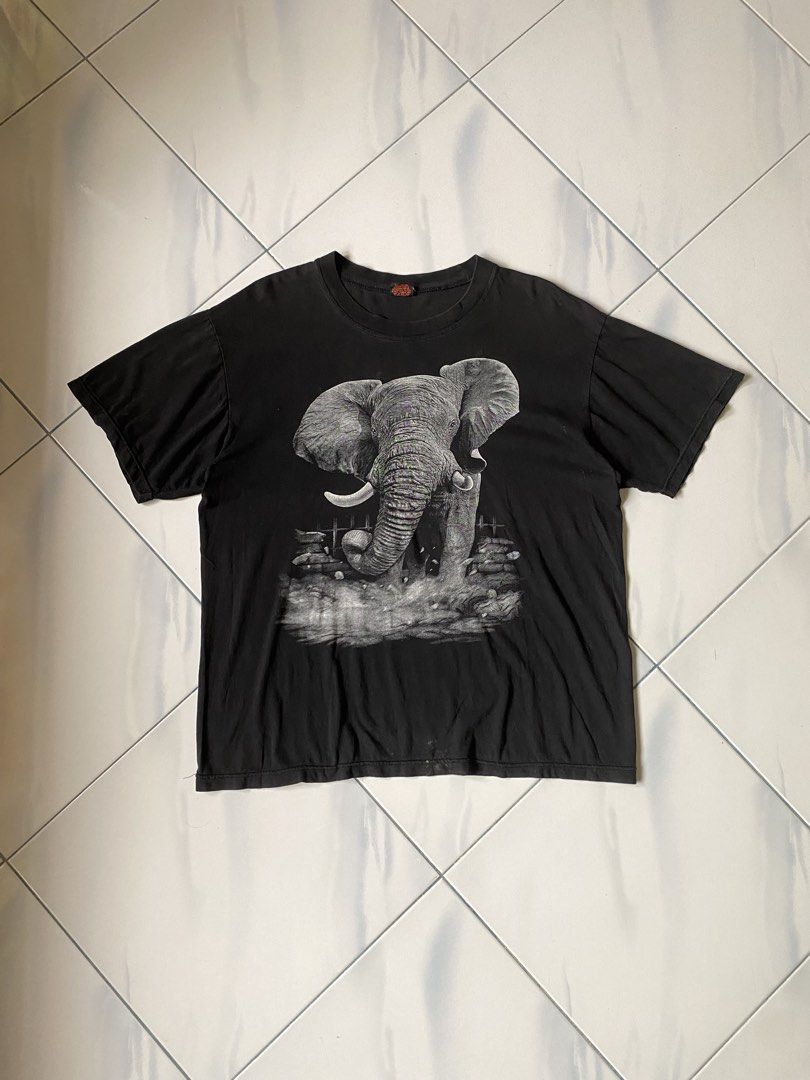 Black Elephant Graphic T-Shirt (Category: Shirts) located in Borongan. Submitted by cybutdiff (Listing ID 1463585532, Image 1). Description: - Cool black t-shirt - Detailed elephant graphic on front and back - Short sleeves - Crew neck - Vintage-inspired look - Great for casual wear - Unique design.