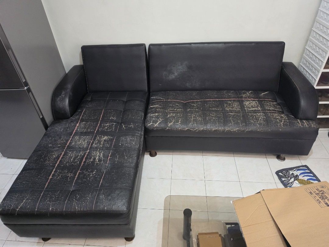 Black L-Shaped Sectional Sofa (Negotiable) (Category: Sofas) located in Quezon City. Submitted by deanryl03 (Listing ID 1463653365, Image 1). Description: - Black L-shaped sectional sofa (2 pcs) - approximately 58 in. X 34 in. for each piece - Good for upholstery - Signs of wear on seat cushions (peeling, scuff marks) - Still functional and comfortable - Ideal for living rooms or apartments - Pick up or delivery only (location: Millionaires Villa