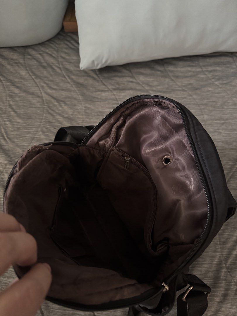 Black Nylon Backpack with Tassel Detail (Category: Backpacks) located in Las Pinas. Submitted by megalleon8 (Listing ID 1463573091, Image 3). Description: - Stylish black nylon backpack - Front zip pocket with a cute tassel charm - Wide-opening main compartment for easy access - Interior pockets for organized storage - Comfortable adjustable shoulder straps - Ideal for everyday errands or your next adventure.
