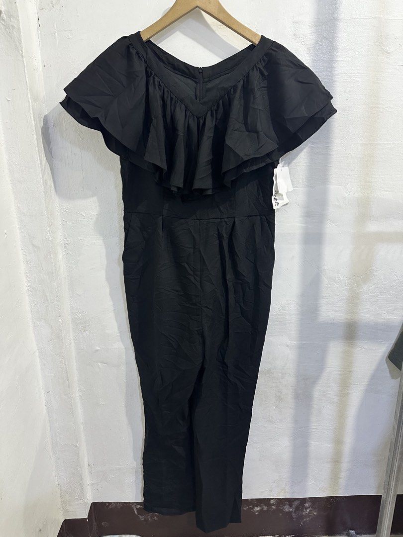 Black Off-Shoulder Ruffle Jumpsuit (Category: Jumpsuits) located in San Jose del Monte. Submitted by bizzybeebyhgc (Listing ID 1463641946, Image 1). Description: - Elegant black jumpsuit - Flattering off-shoulder ruffle detail - Convenient back zipper closure - Functional side pockets - Comfortable polyester blend fabric - Versatile for dressing up or down.