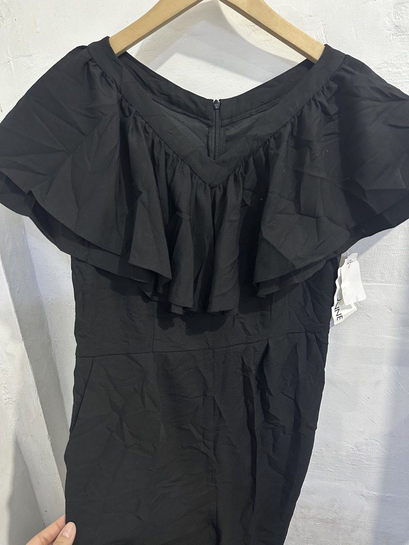 Black Off-Shoulder Ruffle Jumpsuit (Category: Jumpsuits) located in San Jose del Monte. Submitted by bizzybeebyhgc (Listing ID 1463641946, Image 2). Description: - Elegant black jumpsuit - Flattering off-shoulder ruffle detail - Convenient back zipper closure - Functional side pockets - Comfortable polyester blend fabric - Versatile for dressing up or down.