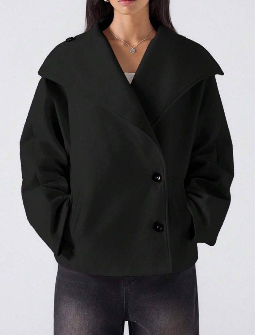 Black Oversized Collar Button Up Jacket (Category: Coats, Jackets and Outerwear) located in Paranaque City. Submitted by declutterr__ (Listing ID 1463613233, Image 1). Description: - Cool black jacket - Unique oversized collar - Can be worn buttoned up or open - Two front buttons and pockets - Voluminous sleeves - Ideal for layering over tops or dresses - Creates a chic, minimalist aesthetic.