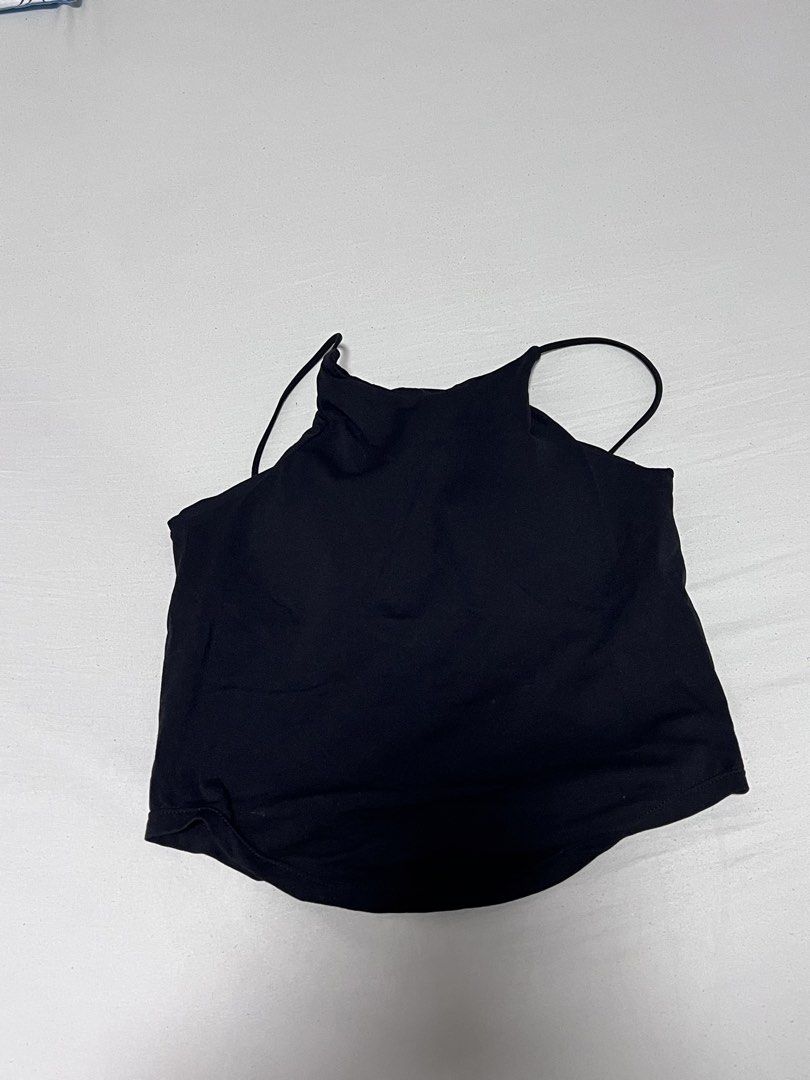 Black Padded Halter Neck Tank Top (Category: Sleeveless) located in Manila. Submitted by sph_preloved (Listing ID 1463623816, Image 1). Description: - Basic black halter neck tank top - Stretchy material for a comfortable fit - Perfect for layering or wearing on its own Location: QC Mode of delivery: grab/lalamove SF to be shouldered by the buyer .