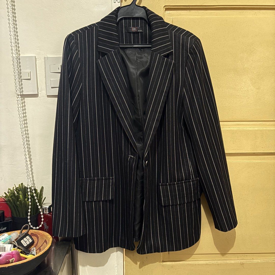 Black Pinstripe Blazer (Category: Coats, Jackets and Outerwear) located in Makati City. Submitted by sseurekiii (Listing ID 1463721146, Image 1). Description: - Classic black blazer with white pinstripes - Single button closure - Two flap pockets on the lower front - Fully lined interior - Versatile for work or a night out.