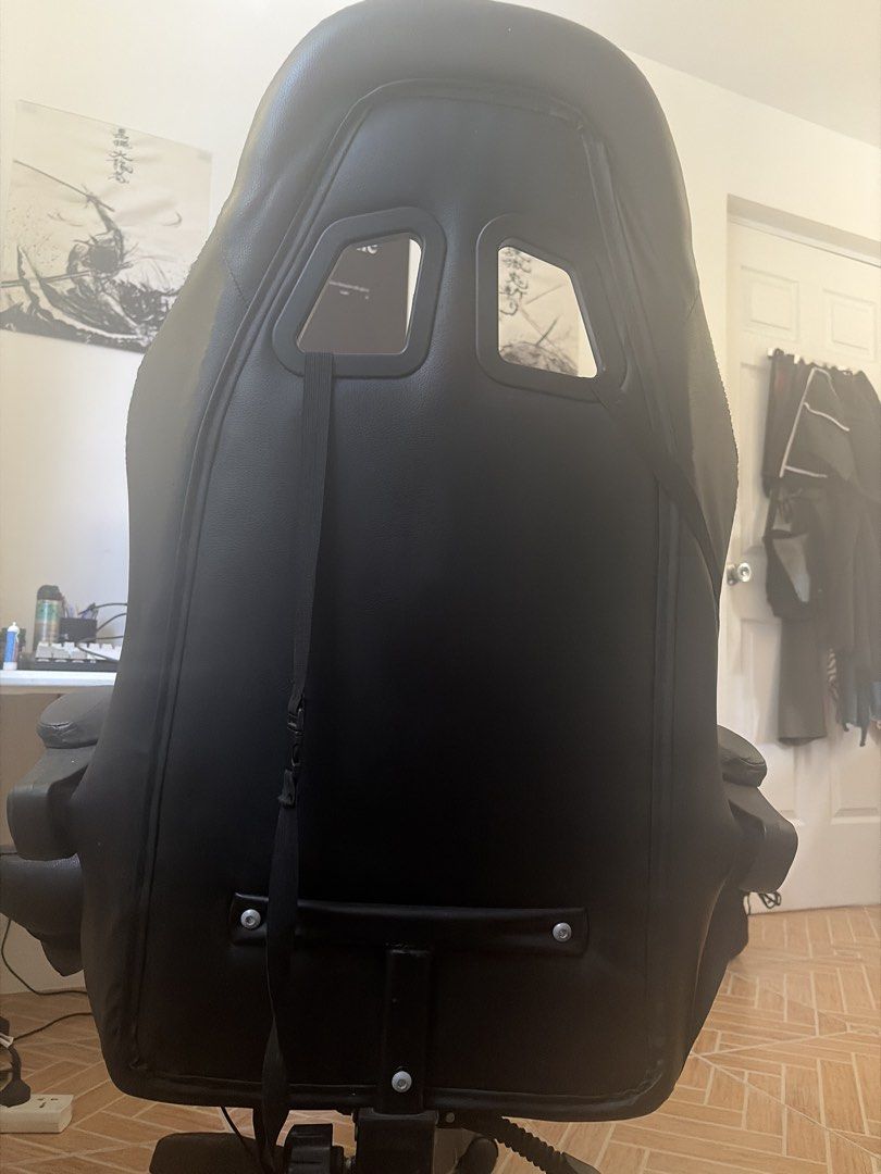 Black PU Leather Gaming Chair with Lumbar Support (Category: Chairs) located in Marikina City. Submitted by pong15 (Listing ID 1463612491, Image 3). Description: - Black PU leather gaming chair - Adjustable lumbar and neck pillows for comfort - Reclining backrest for relaxation - Smooth-rolling wheels for easy mobility - Perfect for long gaming sessions or office work - Hydraulic not working but repairable.
