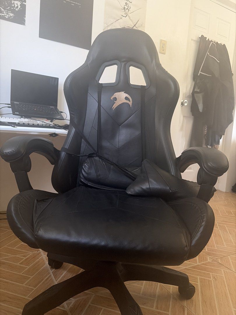Black PU Leather Gaming Chair with Lumbar Support (Category: Chairs) located in Marikina City. Submitted by pong15 (Listing ID 1463612491, Image 1). Description: - Black PU leather gaming chair - Adjustable lumbar and neck pillows for comfort - Reclining backrest for relaxation - Smooth-rolling wheels for easy mobility - Perfect for long gaming sessions or office work - Hydraulic not working but repairable.