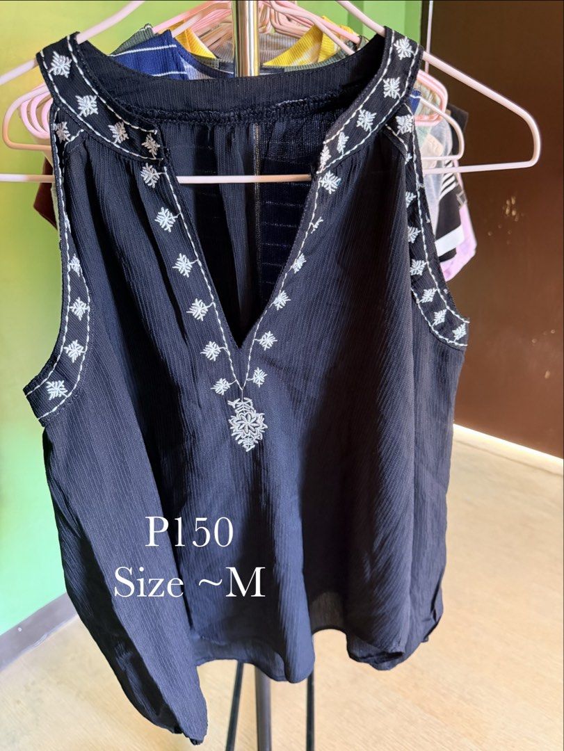 Black Sleeveless Top (Category: Sleeveless) located in Muntinlupa City. Submitted by cocofinds023 (Listing ID 1463712429, Image 1). Description: - Black sleeveless top - Pretty white embroidery around V-neck and down the front - V-neckline - Flowy fit - Textured fabric - Versatile for casual or dressy wear - Fits like a medium.