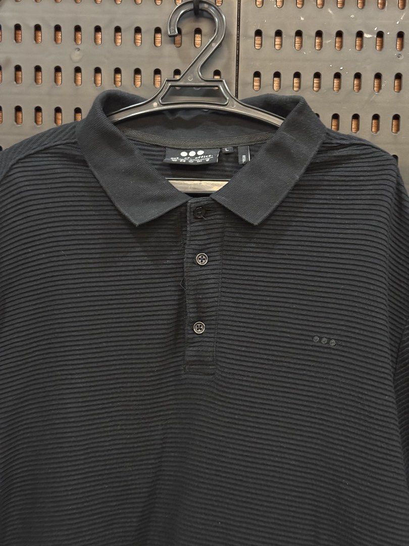 Black Textured Polo Shirt (Category: Tshirts & Polo Shirts ) located in San Fernando. Submitted by archvst.selects (Listing ID 1463669930, Image 2). Description: - Classic black polo shirt - Textured fabric all over - Short sleeves with collar and button placket - Small embroidered logo on chest - Versatile for casual and smart-casual looks - Easy to pair with any outfit Note: Item are personal preloved. Used once. Best fit for 168cm or 5”7.