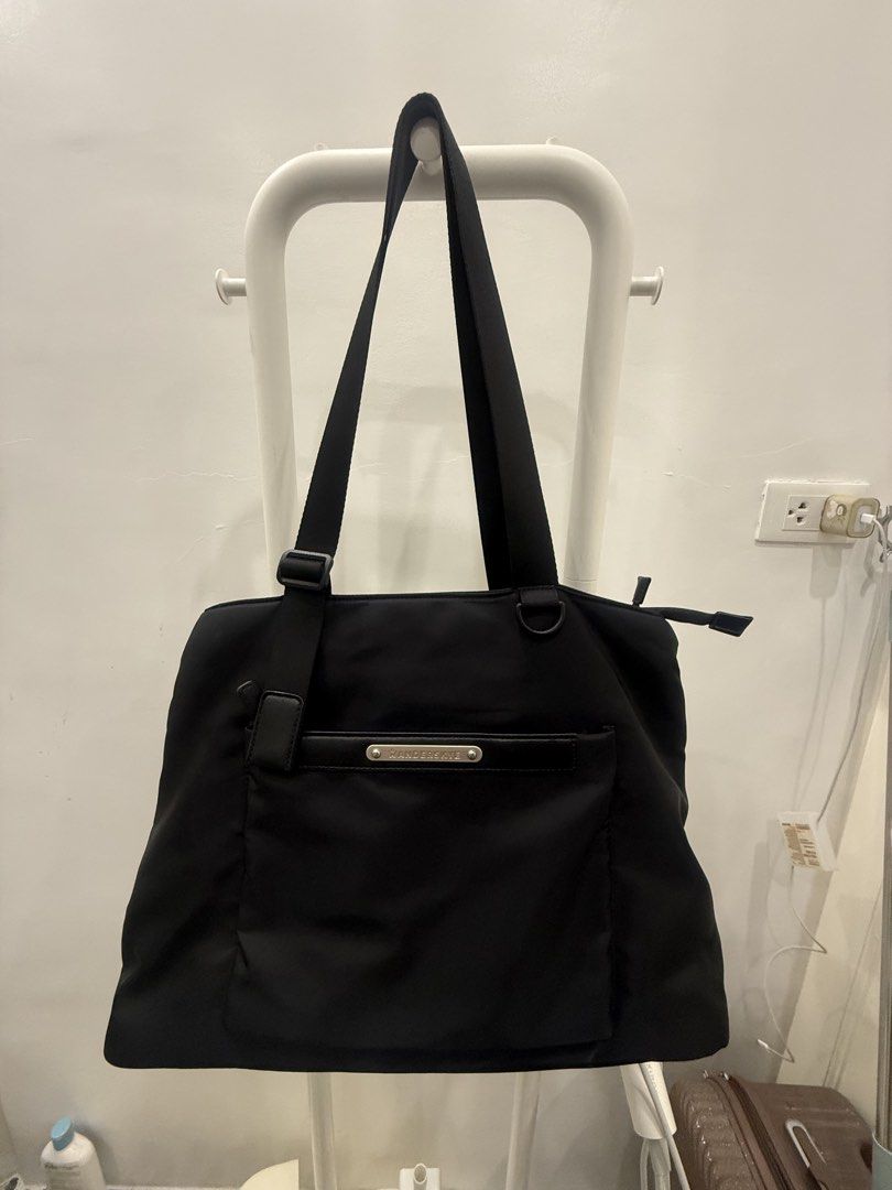 Black Tote Bag with Front Pocket (Category: Tote Bags) located in Quezon City. Submitted by thegoodstuff_ph (Listing ID 1463658477, Image 1). Description: - Classic black tote bag - Large front pocket for easy access - Adjustable straps - Spacious interior for essentials - Ideal for everyday use or travel - Simple and functional design.