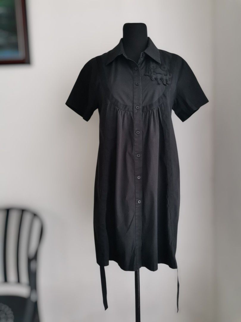 Black Button-down Shirt Dress (Med-Large) (Category: Dresses) located in Quezon City. Submitted by engeleaize (Listing ID 1463602900, Image 1). Description: Details: Color: All black, 9/10 color rate Style: Avant-Garde style minimalist shirt dress, structured collar, short sleeves, chest yoke, button-down, trailing fabric straps with dangling ties at the hem Fabric: Cotton-nylon-spandex blend Best worn: Casual streetwear, creative workplace, gall