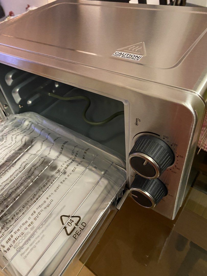 BLAKK 9L Oven Toaster (Category: Ovens & Toasters) located in Taguig. Submitted by domesticgoddess2020 (Listing ID 1463738191, Image 3). Description: - Brand new BLAKK 9L Oven Toaster - Compact size, ideal for small kitchens - Includes baking tray and rack - Stylish brushed stainless steel exterior - Simple dial controls for temperature and timer - Perfect for toasting, baking, and reheating small meals - Comes in original packaging.