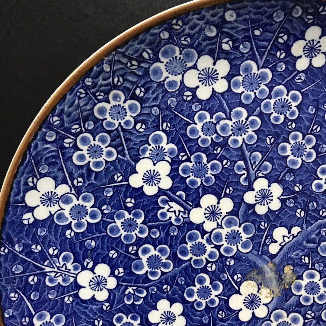 Blue & White Floral Ceramic Decorative Plate (Category: Dinnerware & Cutlery) located in Baao. Submitted by all.things.japan (Listing ID 1463586842, Image 3). Description: 12.25 inches diameter 1.5 inches height - Stunning blue and white ceramic plate - Features an intricate all-over floral pattern - Subtle brown accent on the rim - Ideal for decorative display or as a unique serving dish - Approximate dimensions: [insert size here if known] - A 