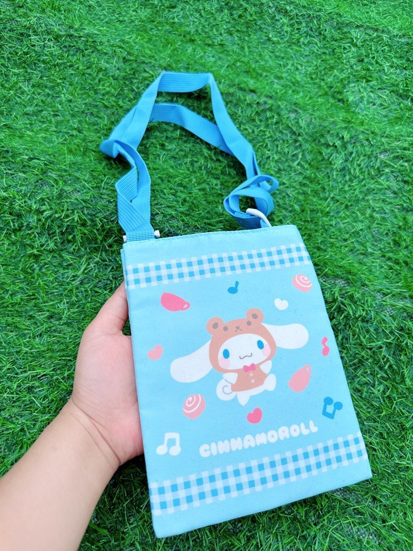 Blue Cinnamoroll Crossbody Bag with Adjustable Strap (Category: Cross-body Bags) located in Manila. Submitted by ronoarabbit.ph (Listing ID 1463669075, Image 1). Description: - Adorable blue crossbody bag featuring Cinnamoroll - Stylish checkered pattern trim - Adjustable strap with buckle for a comfortable fit - Interior features a couple of small pockets for organization - Secure velcro closure - Ideal for carrying your daily essentials 📌Payme