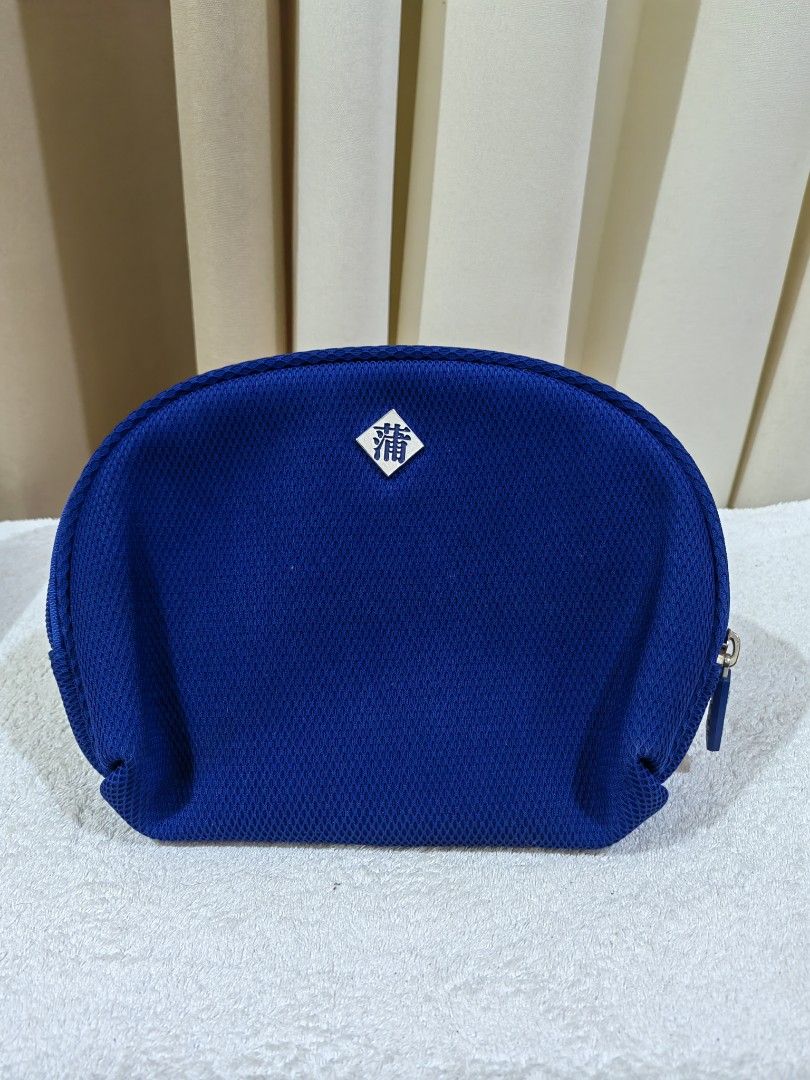 Blue Cosmetic Bag Pouch (Category: Purses & Pouches) located in Makati City. Submitted by prelovedtreatedwithlove (Listing ID 1463739784, Image 1). Description: - Blue cosmetic bag - Zippered main compartment - Inner zippered pocket - Ideal for organizing makeup or toiletries - Smooth working zipper - Textured mesh-like exterior material - no issue .