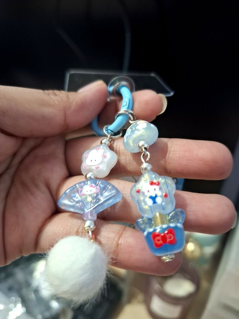 Blue Miffy Hello Kitty Phone Charm (Category: Character Goods) located in Quezon City. Submitted by an.marie (Listing ID 1463632874, Image 2). Description: Super cute Miffy & Kitty keychain charm with colorful beads and a fluffy pom pom. Attaches with a blue ring. Perfect for phone, bags or keys!.
