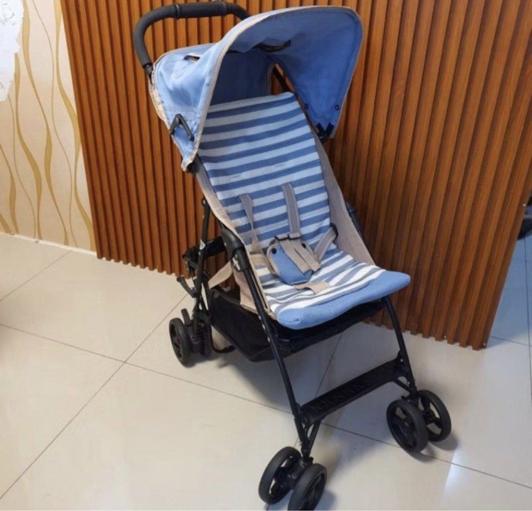 Blue Striped Lightweight Baby Stroller (Category: Strollers) located in Manila. Submitted by swiftmoon.a6f74e (Listing ID 1463579038, Image 2). Description: - Lightweight stroller with stylish blue and white stripes - Canopy provides sun protection for your little one - Convenient storage basket underneath for essentials - Swivel wheels ensure easy maneuverability - Folds compactly for hassle-free storage - Ideal for everyday trips and outings .