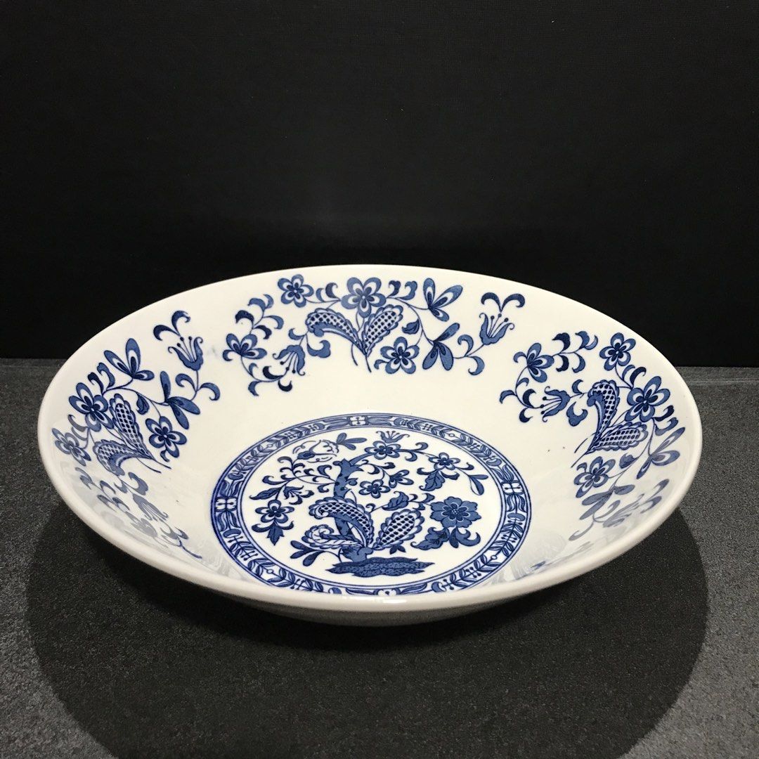 Blue Willow Pattern Ceramic Serving Bowl (Category: Dinnerware & Cutlery) located in Baao. Submitted by all.things.japan (Listing ID 1463583491, Image 1). Description: 9.0 inches diameter 2.5 inches height - Classic blue and white serving bowl - Features iconic Willow pattern with birds and floral motifs - Ideal for salads, pasta, or as a decorative piece - Adds vintage charm to any table setting - Dishwasher safe.