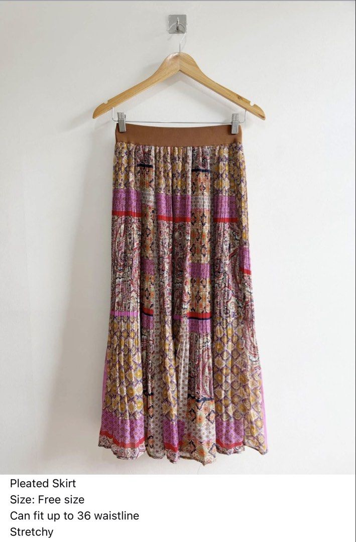 Boho Pleated Midi Skirt Free Size (Category: Skirts) located in Paranaque City. Submitted by closetcoph (Listing ID 1463608505, Image 1). Description: - Boho style pleated midi skirt - Vibrant paisley and geometric print (pink, yellow, red) - Comfortable elasticated waistband - Stretchy material for a great fit - Fits up to a 36-inch waist - Perfect for casual outings or dressing up.