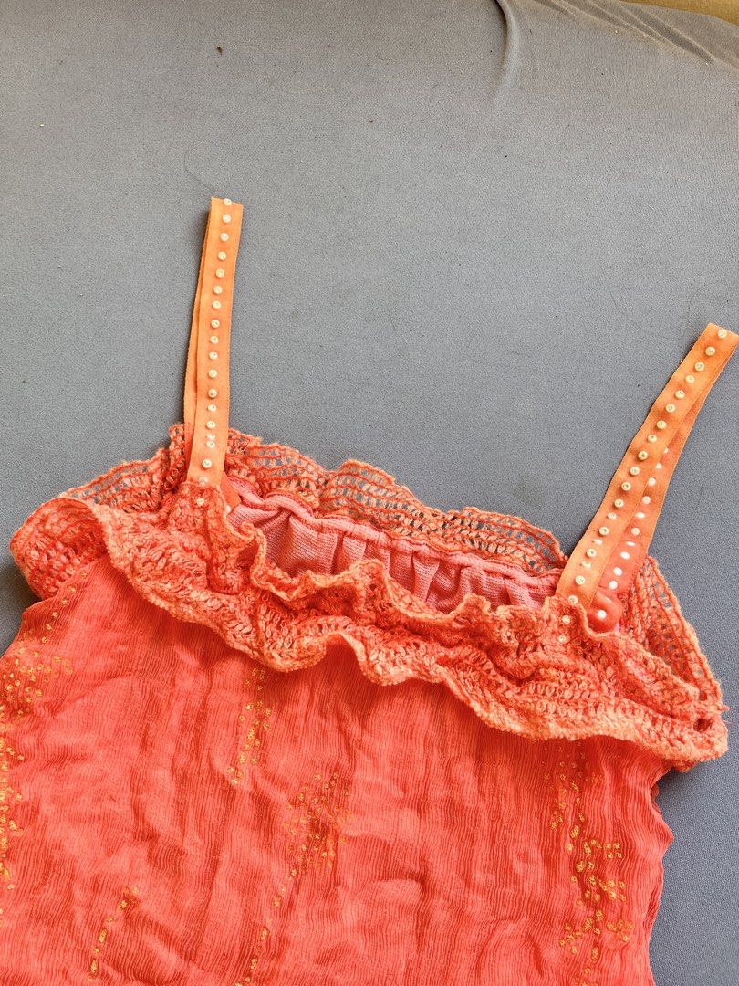 Boho-style crinkle/crinkled camisole top (Category: Sleeveless) located in San Jose. Submitted by thymies (Listing ID 1463648294, Image 2). Description: Can fit Small-Medium Style & Aesthetic: Y2K Boho / Bohemian Cami Top Texture & Fabric: Crinkled / gauze woven fabric with subtle embroidered dot details Neckline & Trim: Crochet lace ruffled neckline Straps: Beaded / sequined ribbon shoulder straps Hem Detail: Side drawstring tie at the bottom co