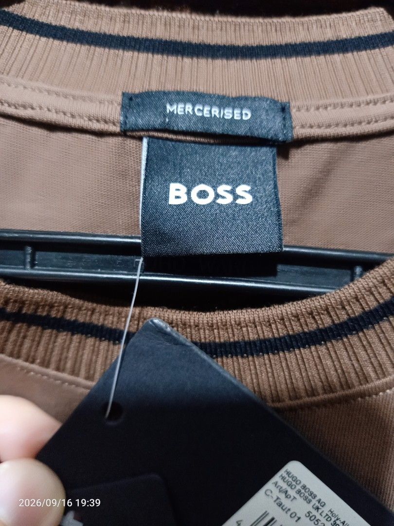 BOSS Mercised T-Shirt Brown (Category: Tshirts & Polo Shirts ) located in Las Pinas. Submitted by OmengSoyT (Listing ID 1463640286, Image 3). Description: - Authentic BOSS T-shirt - Made from premium mercerized cotton - Features embroidered BOSS logo on the chest - Ribbed collar and sleeve cuffs with stylish dark stripes - Brand new with tags attached - Excellent quality material for comfort and durability.