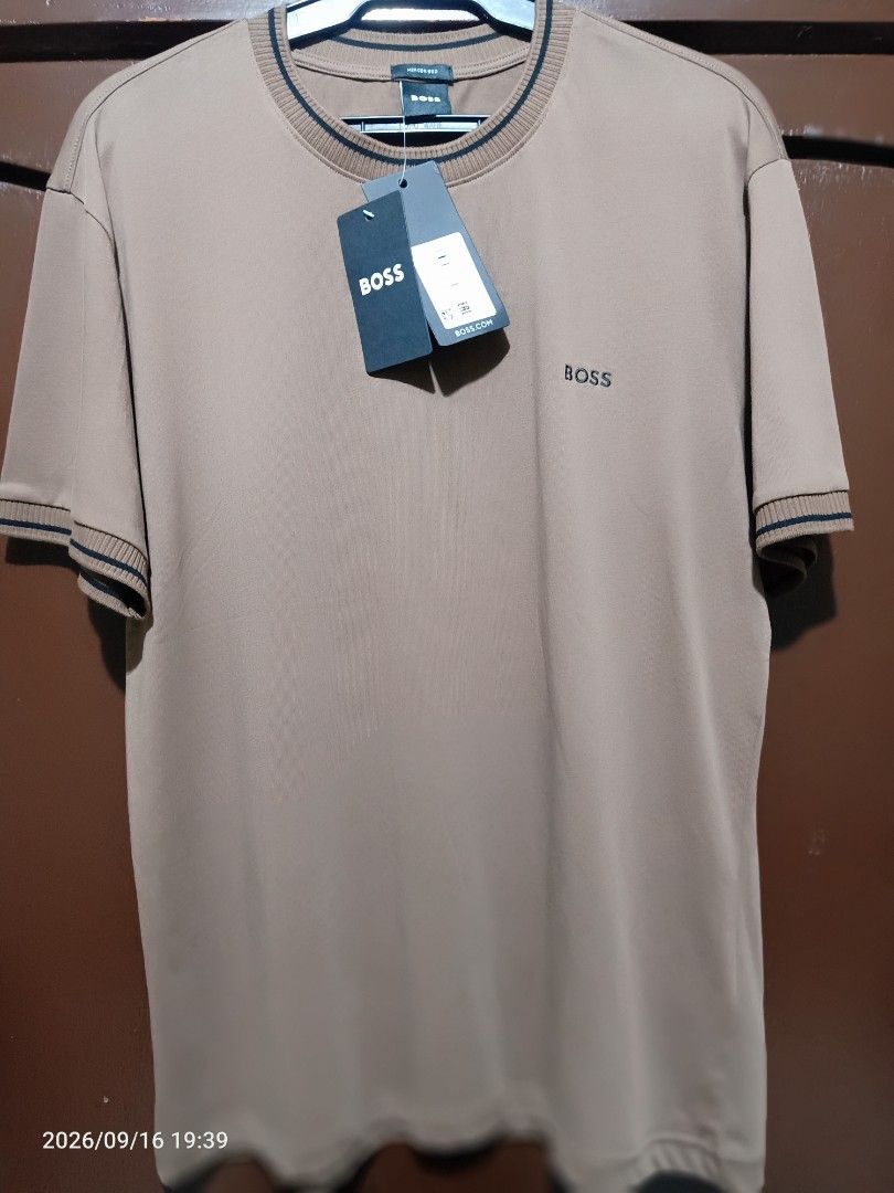 BOSS Mercised T-Shirt Brown (Category: Tshirts & Polo Shirts ) located in Las Pinas. Submitted by OmengSoyT (Listing ID 1463640286, Image 2). Description: - Authentic BOSS T-shirt - Made from premium mercerized cotton - Features embroidered BOSS logo on the chest - Ribbed collar and sleeve cuffs with stylish dark stripes - Brand new with tags attached - Excellent quality material for comfort and durability.