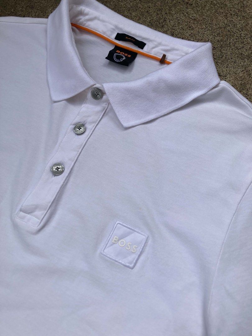 BOSS Passenger Polo Shirt (Category: Luxury Apparel) located in Dapitan. Submitted by thrift_archive2026 (Listing ID 1463668177, Image 3). Description: •𝐚 𝐜𝐥𝐚𝐬𝐬𝐢𝐜 𝐬𝐥𝐢𝐦-𝐟𝐢𝐭, 𝐬𝐡𝐨𝐫𝐭-𝐬𝐥𝐞𝐞𝐯𝐞𝐝 𝐩𝐨𝐥𝐨 𝐬𝐡𝐢𝐫𝐭 𝐜𝐫𝐚𝐟𝐭𝐞𝐝 𝐟𝐫𝐨𝐦 𝐚 𝐬𝐭𝐫𝐞𝐭𝐜𝐡-𝐜𝐨𝐭𝐭𝐨𝐧 𝐩𝐢𝐪𝐮é 𝐟𝐚𝐛𝐫𝐢𝐜, 𝐟𝐞𝐚𝐭𝐮𝐫𝐢𝐧𝐠 𝐚 𝐬𝐢𝐠𝐧𝐚𝐭𝐮𝐫𝐞 𝐰𝐨𝐯𝐞𝐧 𝐥𝐨𝐠𝐨 𝐩𝐚𝐭𝐜𝐡 𝐨𝐧 𝐭𝐡𝐞 𝐥𝐞𝐟𝐭 𝐜𝐡𝐞𝐬𝐭. 𝐀𝐮𝐭𝐡𝐞𝐧𝐭𝐢𝐜 ✅ 𝐒𝐢𝐳𝐞: �