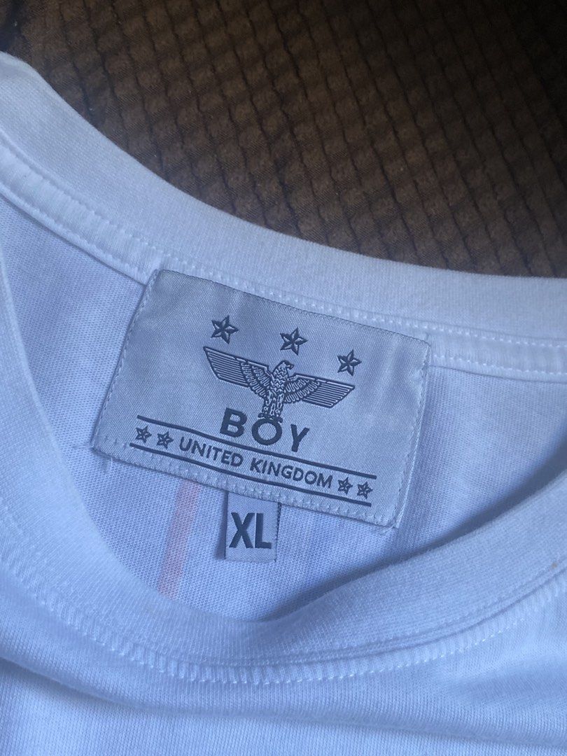 BOY London Eagle Graphic T-Shirt White (Category: Tshirts & Polo Shirts ) located in Manila. Submitted by wheeze_2208 (Listing ID 1463692385, Image 2). Description: - White BOY LONDON T-shirt - Iconic eagle graphic on the front - 'BOY LONDON' text stripes down the back - Size: XL - Made in Korea - Ideal for casual wear - Bought this for $60 .