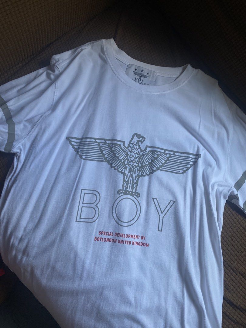 BOY London Eagle Graphic T-Shirt White (Category: Tshirts & Polo Shirts ) located in Manila. Submitted by wheeze_2208 (Listing ID 1463692385, Image 1). Description: - White BOY LONDON T-shirt - Iconic eagle graphic on the front - 'BOY LONDON' text stripes down the back - Size: XL - Made in Korea - Ideal for casual wear - Bought this for $60 .