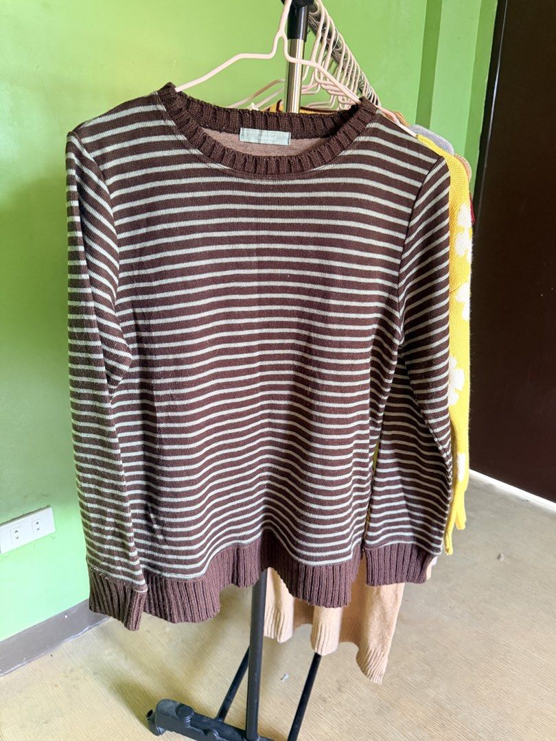 Brown and white striped long-sleeved sweater (Category: Coats, Jackets and Outerwear) located in Muntinlupa City. Submitted by cocofinds023 (Listing ID 1463714092, Image 1). Description: - Classic brown and white striped design - Long sleeves with ribbed cuffs and hem - Made from comfortable knit material - Versatile for layering or standalone wear - Easily pairs with jeans or skirts.