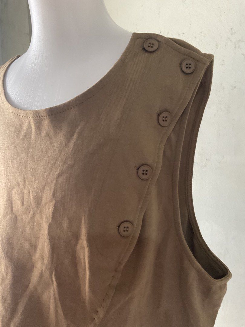 Brown Asymmetrical Button Vest with Pocket Detail (Category: Sleeveless) located in Manila. Submitted by horangborahae (Listing ID 1463604231, Image 2). Description: - Cool brown vest - Asymmetrical hemline - Unique side button closure - Small pocket detail - Open back with strap and ring detail - Ideal for layering over tops or dresses.