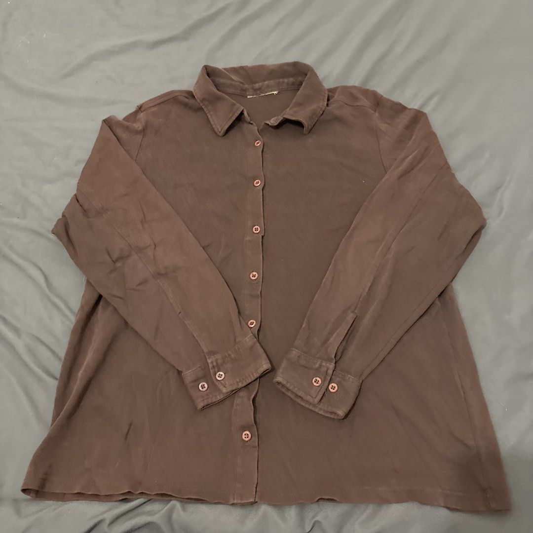 Brown Long Sleeve Button Up Shirt (Category: Longsleeves) located in Makati City. Submitted by sseurekiii (Listing ID 1463721542, Image 1). Description: - Classic brown long sleeve shirt - Button-up front with collar - Comfortable material - Great for layering or wearing on its own - Versatile for casual or smart casual looks.