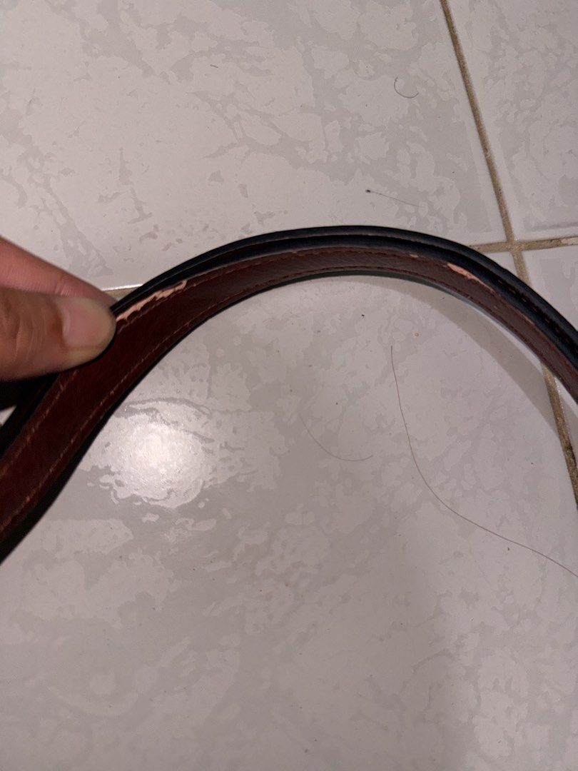 Brown Mango Shoulder Bag (Category: Shoulder Bags) located in Lucena. Submitted by lcndeclutter (Listing ID 1463656808, Image 3). Description: - Mango brown shoulder bag (can also be used as sling bag) - Curved shape with gold clasp closure - Strap shows wear and tear (peeling edges) - Black fabric interior - Perfect for everyday use.