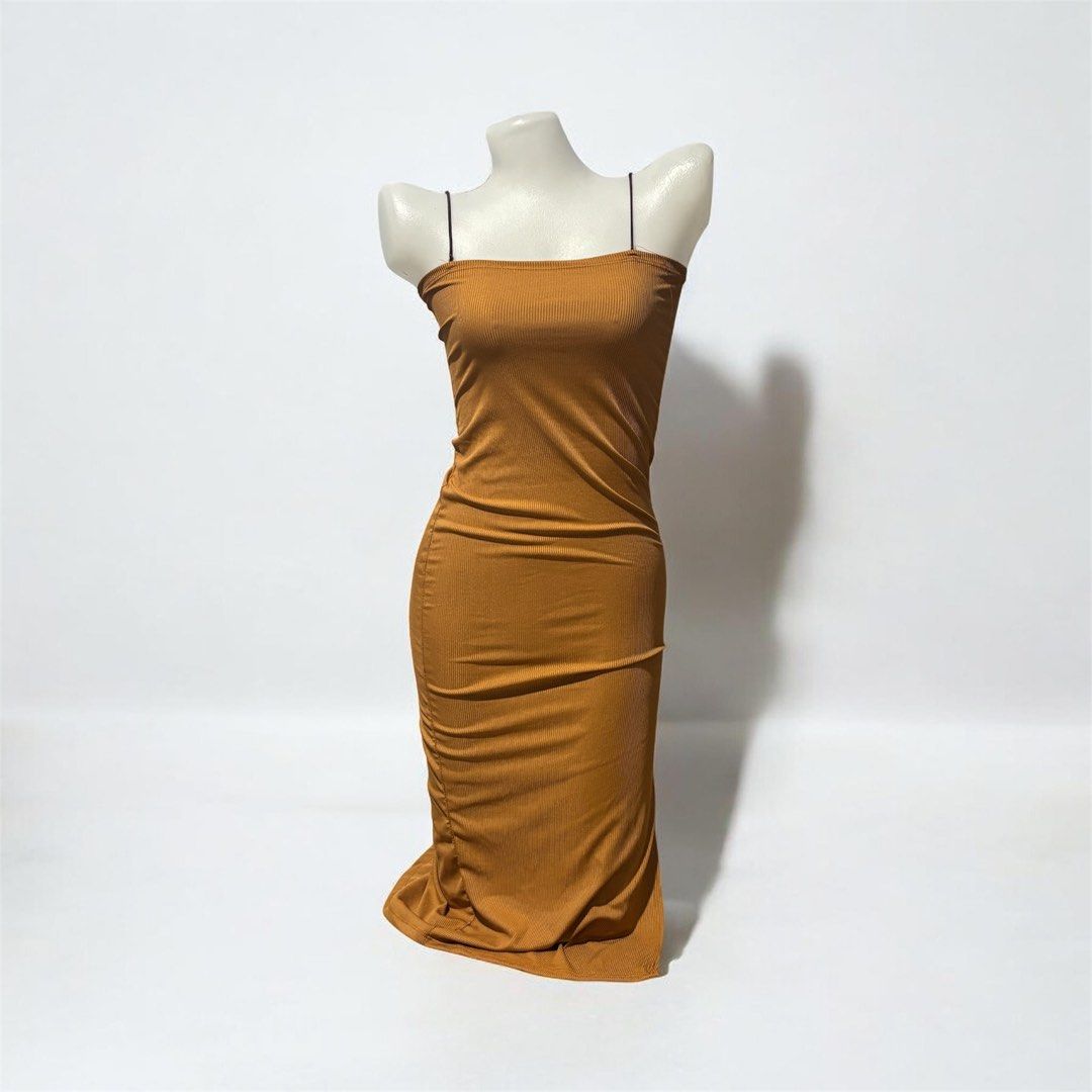 Brown Ribbed Spaghetti Strap Midi Dress (Category: Dresses) located in Santa Cruz. Submitted by homedecluttersale (Listing ID 1463651384, Image 1). Description: • Fits small to medium • In excellent condition 🚚 Shipping via J&T only 📦 Shipping fee to be shouldered by buyer 💳 Mode of payment: GCash 📍 Santa Cruz, Laguna.
