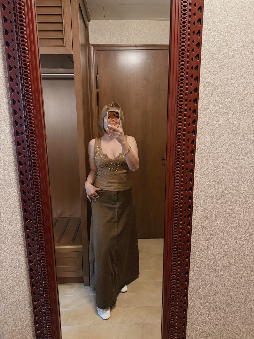Brown Studded Tank Top & Maxi Skirt Set (Category: Sets or Coordinates) located in Taguig. Submitted by JHOs.it.up (Listing ID 1463689576, Image 2). Description: USED ONCE ONLY IN HONGKONG VERY CUTE OOTD - Cute brown tank top with stud details - Matching brown maxi skirt included - Scoop neckline and adjustable straps on tank top - Relaxed fit on maxi skirt - Versatile pieces for casual or night out styling - Can be styled in many different ways.