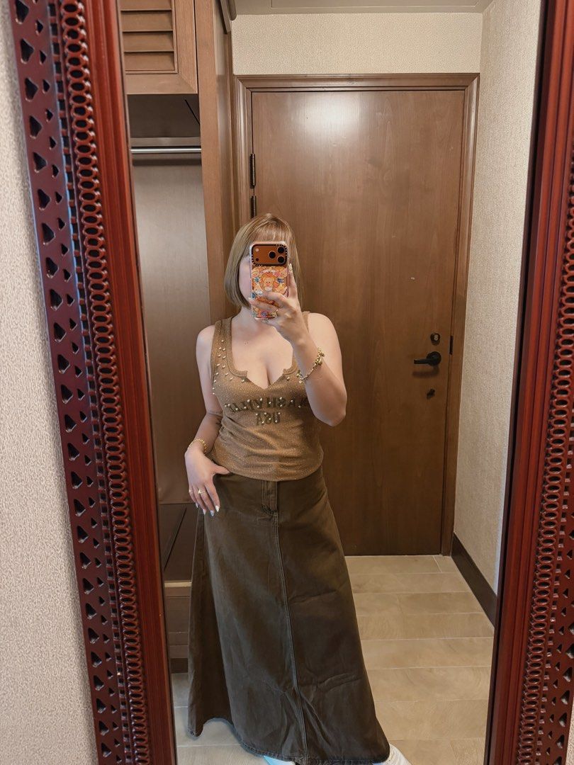 Brown Studded Tank Top & Maxi Skirt Set (Category: Sets or Coordinates) located in Taguig. Submitted by JHOs.it.up (Listing ID 1463689576, Image 1). Description: USED ONCE ONLY IN HONGKONG VERY CUTE OOTD - Cute brown tank top with stud details - Matching brown maxi skirt included - Scoop neckline and adjustable straps on tank top - Relaxed fit on maxi skirt - Versatile pieces for casual or night out styling - Can be styled in many different ways.