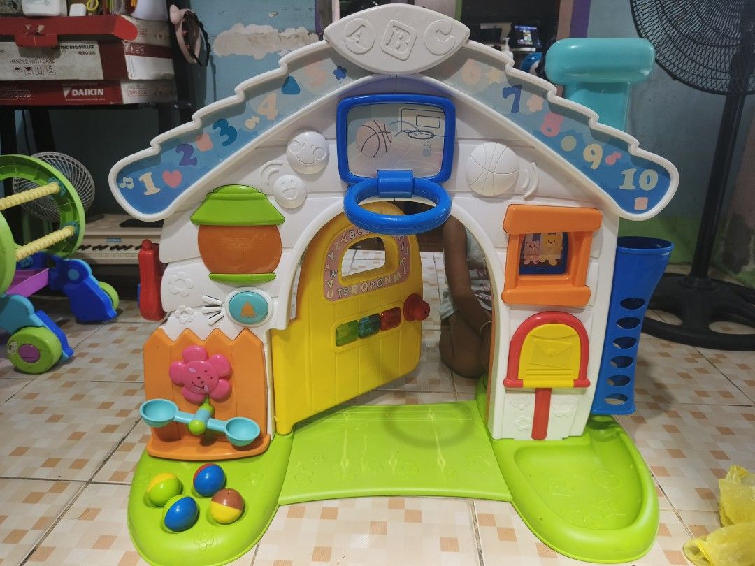 Bruin Lights & Sound House Playset (Category: Kids Toys) located in Caloocan City. Submitted by mckysprelove (Listing ID 1463592496, Image 3). Description: - Bruin Lights & Sound House playset - Interactive buttons and sounds for engaging play - Features a clock, alphabet door, and basketball hoop - Comes with balls and other accessories - Ideal for toddlers learning and having fun Bruin Double-Sided Playable! Light & Sound House Tested and worki
