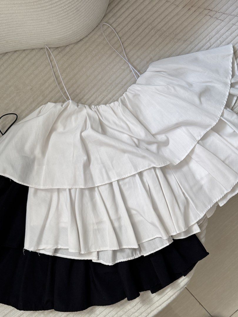 [BUNDLE] Black and White Ruffle Off-Shoulder Top (Category: Blouses) located in Dasmarinas. Submitted by ella.i2 (Listing ID 1463635629, Image 3). Description: - Cute ruffled top - Features thin spaghetti straps - Note: White side has a few small make up stains (can still be removed with a wash) - Versatile: great for a night out or casual wear 📍Dasma.