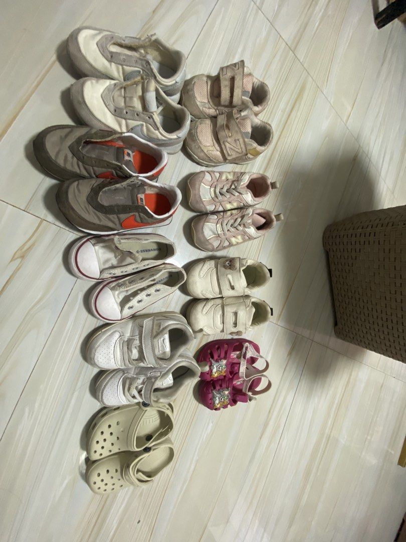 Bundle of Kids Shoes - Various Brands & Sizes (Category: Babies & Kids Fashion) located in Manila. Submitted by swiftmoon.a6f74e (Listing ID 1463581021, Image 2). Description: - Bundle of pre-loved kids' shoes - Includes sneakers, sandals, and clogs - Brands: Nike, Converse, New Balance (visible) - Closure types: Velcro straps and laces - Ideal for everyday wear and playtime - Please check photos for individual shoe details.